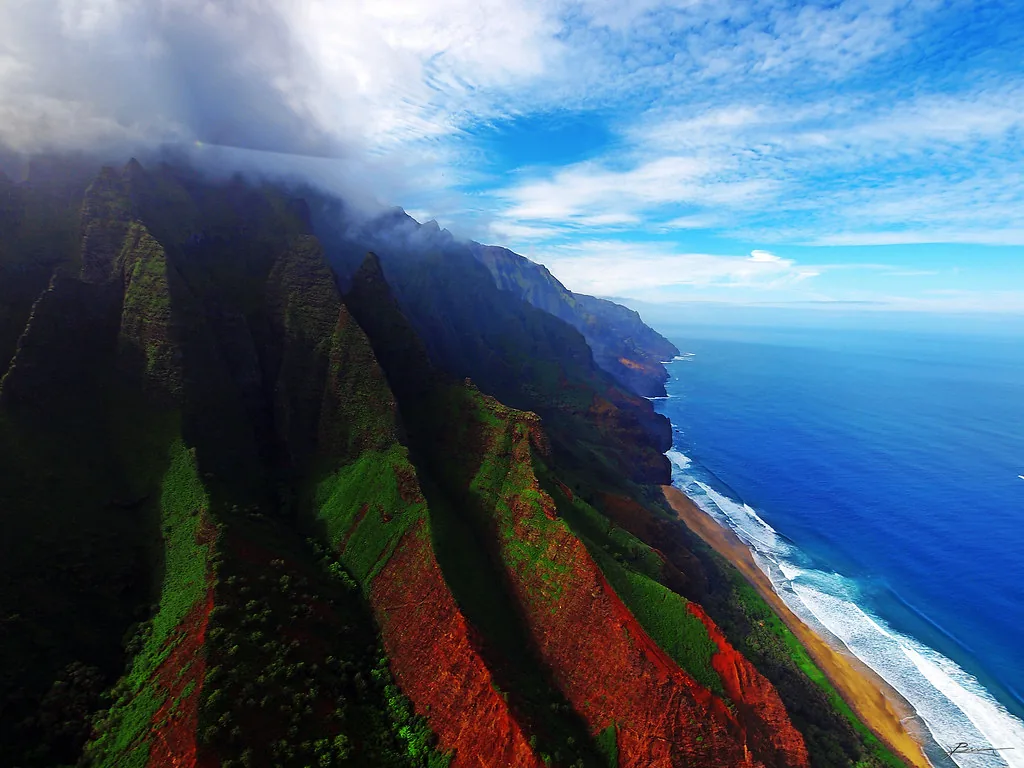 The green ridges and blue Pacific coastline of Nāpali, Kauaʻi